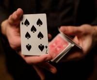 man-showing-tricks-with-cards-P2PY2FM